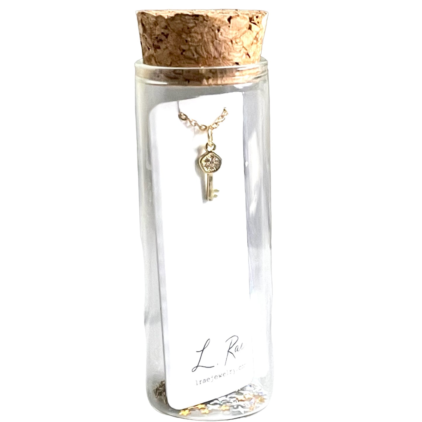 Tiny Pave Key Charm Necklace. Glass Vial Display