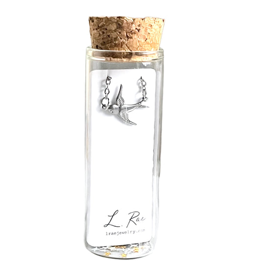 Sparrow Bird Charm Necklace. Glass Vial Display